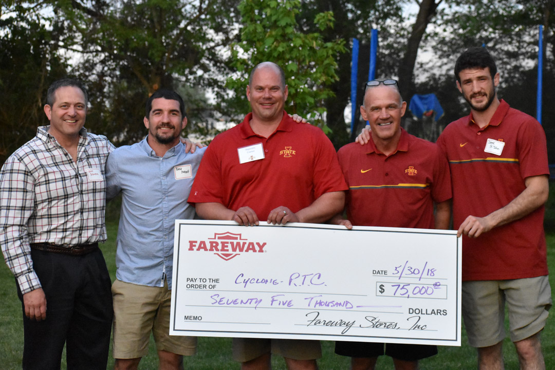 Group of Supporters presenting Coach Kevin Dresser with a $75,000 Checker
