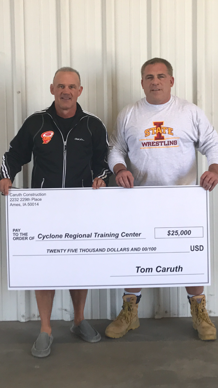 Coach Kevin Dresser with a Check for $25,000